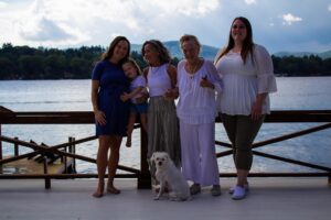 family portrait next to lake